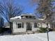 Gray house with front porch, freshly painted, needs landscaping at 1318 N Lasalle St, Indianapolis, IN 46201