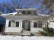 House exterior in winter with snow-covered front yard at 1318 N Lasalle St, Indianapolis, IN 46201