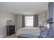 Bright bedroom with a comfortable bed and window coverings at 1405 Sheek Rd, Greenwood, IN 46143