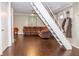 Brown leather sectional sofa and dark hardwood floors at 1405 Sheek Rd, Greenwood, IN 46143