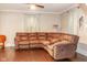 Brown leather sectional sofa and dark hardwood floors at 1405 Sheek Rd, Greenwood, IN 46143