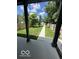 View of backyard featuring a walkway surrounded by green grass and a wooden fence at 1656 Roosevelt Ave, Indianapolis, IN 46218