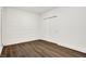Finished basement room with white brick and wood flooring at 1656 Roosevelt Ave, Indianapolis, IN 46218