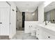Elegant bathroom featuring a walk-in shower and double vanity at 1656 Roosevelt Ave, Indianapolis, IN 46218