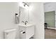 Simple bathroom with single vanity and toilet at 1656 Roosevelt Ave, Indianapolis, IN 46218