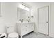 Clean bathroom with double vanity and marble flooring at 1656 Roosevelt Ave, Indianapolis, IN 46218