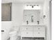 Modern bathroom with double vanity and a large mirror at 1656 Roosevelt Ave, Indianapolis, IN 46218