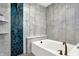 Spa-like bathroom with soaking tub and hexagon tile at 1656 Roosevelt Ave, Indianapolis, IN 46218