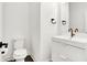 Clean and modern bathroom with white vanity and dark hardware at 1656 Roosevelt Ave, Indianapolis, IN 46218