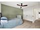 Charming bedroom with double doors leading to hallway at 1656 Roosevelt Ave, Indianapolis, IN 46218