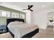 Spacious bedroom with a ceiling fan and large windows at 1656 Roosevelt Ave, Indianapolis, IN 46218