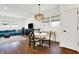 Modern dining area with round table and chairs, adjacent to living room at 1656 Roosevelt Ave, Indianapolis, IN 46218