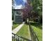 Beautiful two-story home with a walkway leading to the front door and a black fence at 1656 Roosevelt Ave, Indianapolis, IN 46218