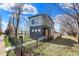 A stylish two-story home featuring a modern design, a front yard, and a walkway leading to the entrance at 1656 Roosevelt Ave, Indianapolis, IN 46218