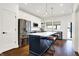 Stylish kitchen featuring stainless steel appliances and white shaker cabinets at 1656 Roosevelt Ave, Indianapolis, IN 46218