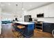 Open concept kitchen with stainless steel appliances and a large island at 1656 Roosevelt Ave, Indianapolis, IN 46218