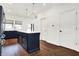 Navy blue kitchen island with white quartz countertop and gold pendant lighting at 1656 Roosevelt Ave, Indianapolis, IN 46218