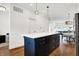 Modern kitchen island with navy blue cabinets and white countertop at 1656 Roosevelt Ave, Indianapolis, IN 46218