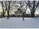 Brick house with snow covered yard at 1726 Mccollough Dr, Indianapolis, IN 46260