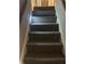 Carpeted staircase with nightlight at 1726 Mccollough Dr, Indianapolis, IN 46260