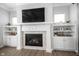 Elegant fireplace with white mantel and built-in cabinetry on either side at 1825 Avondale Dr, Westfield, IN 46074