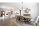 Modern white kitchen with island, stainless steel appliances, and an open layout to the dining area at 1825 Avondale Dr, Westfield, IN 46074