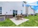 Back patio includes patio seating and well-maintained lawn at 18632 Walsh Way, Westfield, IN 46074