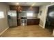 Modern kitchen with stainless steel appliances and wood cabinets at 1918 Elm St, Columbus, IN 47201