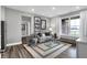 Comfortable living room with a modern rug, gray furniture, and natural light at 19341 Sumrall Pl, Westfield, IN 46074