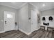 Mudroom with built-in storage, hooks for backpacks, and a decorative front door at 19341 Sumrall Pl, Westfield, IN 46074