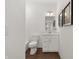 Simple white bathroom with a shower-tub combo, wood-look floors, and a modern vanity at 19357 Sumrall Pl, Westfield, IN 46074