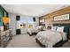Bright bedroom with two beds, wood accent wall, and light-filled windows at 19357 Sumrall Pl, Westfield, IN 46074