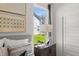 Bright bedroom with a sunny window view, stylish side table, and a modern lamp at 19357 Sumrall Pl, Westfield, IN 46074