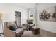 Bright bedroom featuring two comfortable armchairs, modern art and lots of natural light at 19357 Sumrall Pl, Westfield, IN 46074