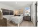 Cozy bedroom with a bed, side tables, lamps, and two unique paintings at 19357 Sumrall Pl, Westfield, IN 46074