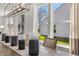Dining room with a wooden table, modern art, neutral decor and view to the backyard at 19357 Sumrall Pl, Westfield, IN 46074