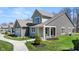 Side view of a charming two-story home with lush green grass and landscaping at 19357 Sumrall Pl, Westfield, IN 46074