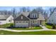 Charming two-story home with landscaped yard and a two-car garage in a suburban neighborhood at 19357 Sumrall Pl, Westfield, IN 46074