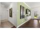 Hallway featuring a TV and lots of natural light leading to a door at 19357 Sumrall Pl, Westfield, IN 46074
