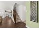 View of the stairs, the entry door and the kitchen at 19357 Sumrall Pl, Westfield, IN 46074