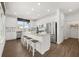 Bright, eat-in kitchen featuring white cabinets, granite counters, stainless appliances, and a large island at 19357 Sumrall Pl, Westfield, IN 46074