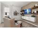 Comfortable living room featuring a plush armchair, custom shelving and a large window at 19357 Sumrall Pl, Westfield, IN 46074