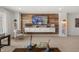 Living space featuring mounted TV, chair, and white cabinets with decor at 19357 Sumrall Pl, Westfield, IN 46074
