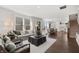 Open concept living space with view to dining area, staircase, and hardwood floors throughout at 19357 Sumrall Pl, Westfield, IN 46074