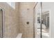 Modern shower with a glass door, tiled walls, and a built-in seat, creating a spa-like experience at 19357 Sumrall Pl, Westfield, IN 46074