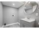 Bathroom featuring vanity with mirror, light gray walls and gray wood-look floors at 2005 E Maryland St, Indianapolis, IN 46201