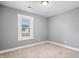 Bright bedroom with neutral carpet, fresh paint, and window with blinds at 2005 E Maryland St, Indianapolis, IN 46201