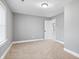 Bedroom with neutral carpet, gray walls, white trim, and lots of natural light at 2005 E Maryland St, Indianapolis, IN 46201