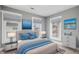 Stylish bedroom featuring coordinated decor, comfortable bedding, and large windows for natural light at 2005 E Maryland St, Indianapolis, IN 46201