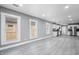 Bright, open-concept living area with modern flooring leading into a well-equipped kitchen and dining space at 2005 E Maryland St, Indianapolis, IN 46201